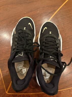 Nike Paul George shoes with White Soles and Gold Swoosh